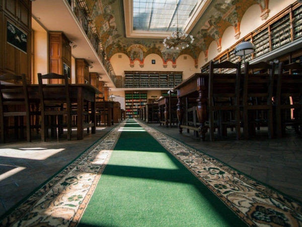 a large church with a green carpet